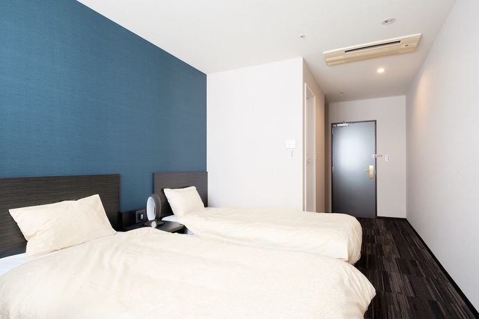 Imagen de la habitación del Hotel The Premium In Rinku. Foto 5