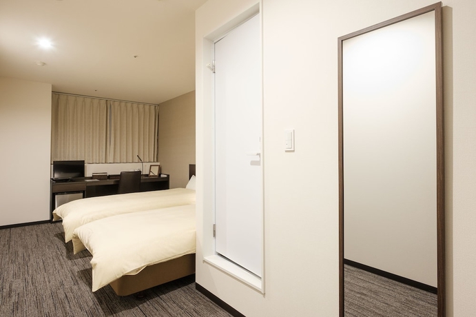 Imagen de la habitación del Hotel The Premium In Rinku. Foto 11