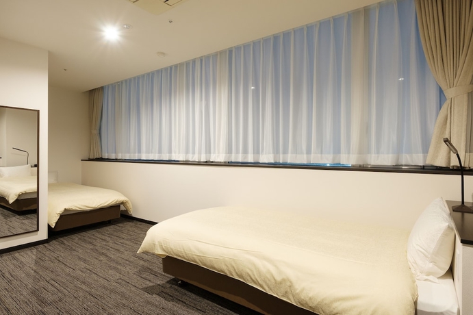 Imagen de la habitación del Hotel The Premium In Rinku. Foto 13