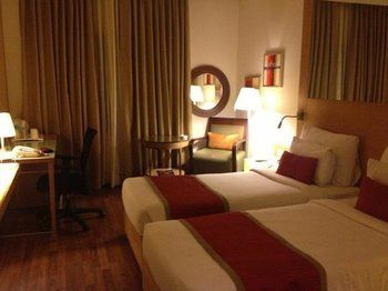 Imagen de la habitación del Hotel The Pride Chennai. Foto 9