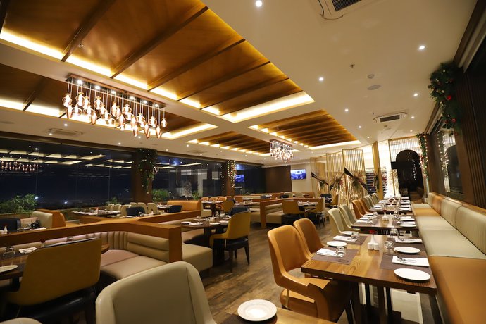 Imagen del bar/restaurante del Hotel The Pristine Kanpur. Foto 7