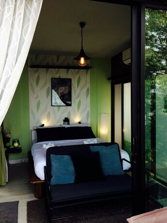 Imagen de la habitación del Hotel The Proud Green Garden Hill Resort. Foto 33