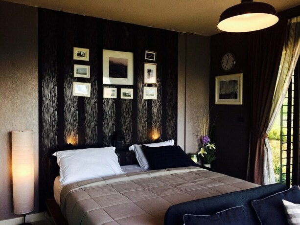 Imagen de la habitación del Hotel The Proud Green Garden Hill Resort. Foto 35
