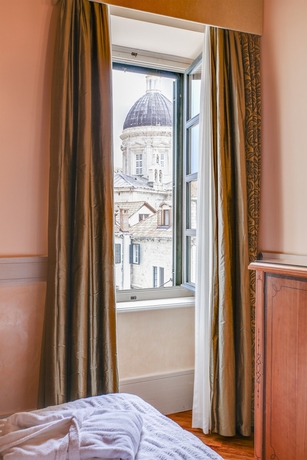 Imagen de la habitación del Hotel The Pucic Palace. Foto 13