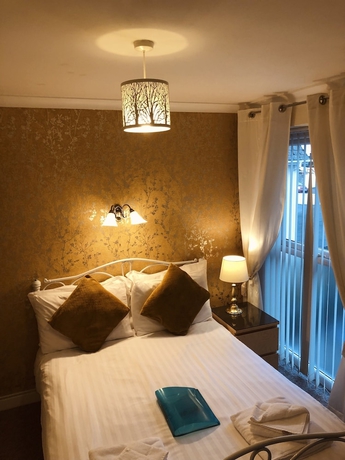 Imagen de la habitación del Hotel The Purple Tree Guest House. Foto 2