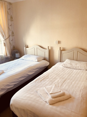 Imagen de la habitación del Hotel The Purple Tree Guest House. Foto 9