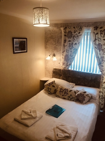 Imagen de la habitación del Hotel The Purple Tree Guest House. Foto 11