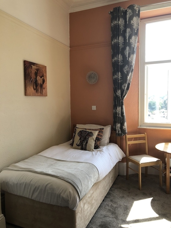 Imagen de la habitación del Hotel The Purple Tree Guest House. Foto 13
