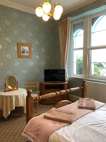 Imagen de la habitación del Hotel The Purple Tree Guest House. Foto 15