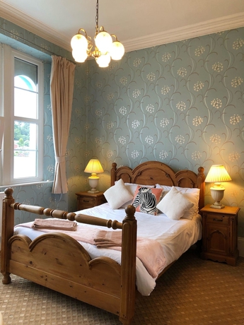 Imagen de la habitación del Hotel The Purple Tree Guest House. Foto 16
