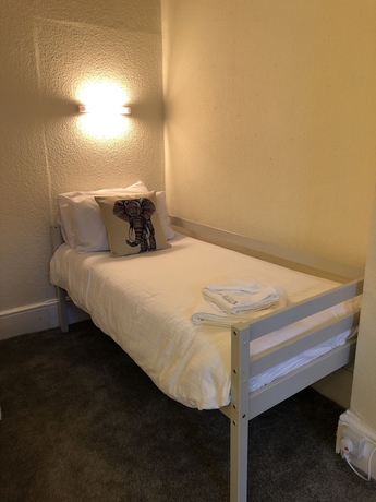 Imagen de la habitación del Hotel The Purple Tree Guest House. Foto 17