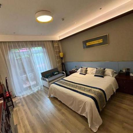 Imagen de la habitación del Hotel The Qomolangma Hotel Beijing China. Foto 3
