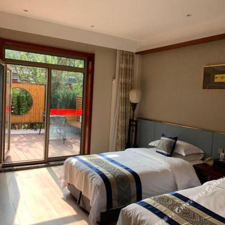 Imagen de la habitación del Hotel The Qomolangma Hotel Beijing China. Foto 4