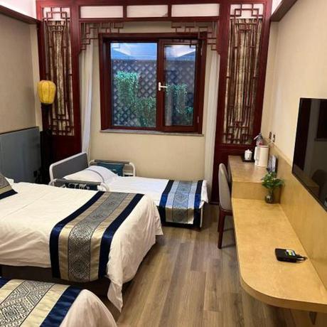 Imagen de la habitación del Hotel The Qomolangma Hotel Beijing China. Foto 9
