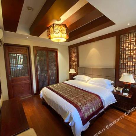 Imagen de la habitación del Hotel The Qomolangma Hotel Beijing China. Foto 11