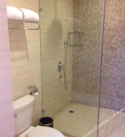 Imagen de la habitación del Hotel The Qomolangma Hotel Beijing China. Foto 12