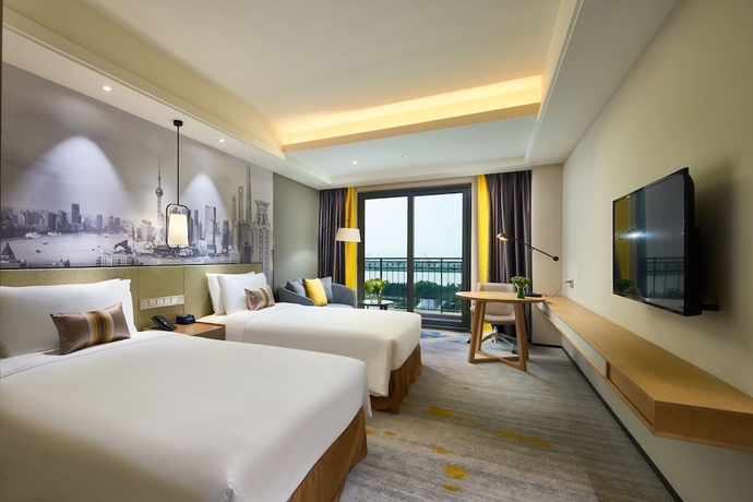 Imagen de la habitación del Hotel The Qube Shanghai Sanjiagang. Foto 3