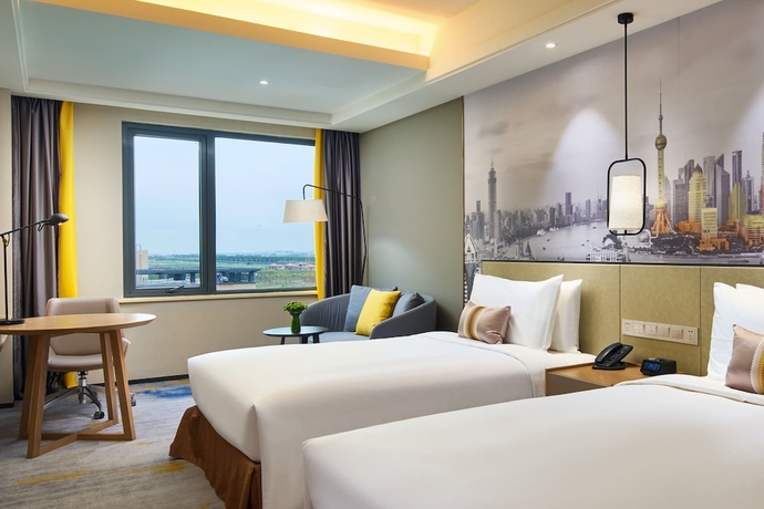 Imagen de la habitación del Hotel The Qube Shanghai Sanjiagang. Foto 17