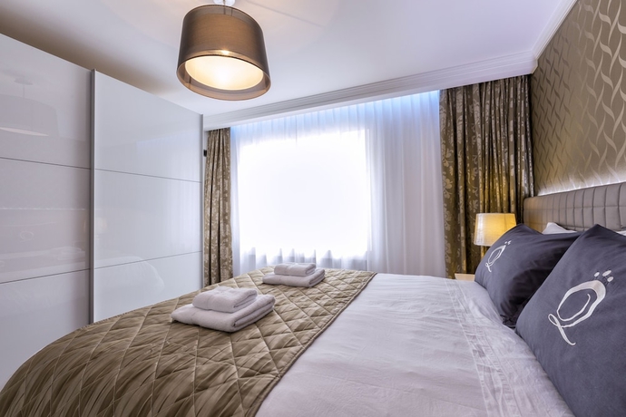 Imagen de la habitación del Hotel The Queen Luxury Apartments Villa Vinicia. Foto 9
