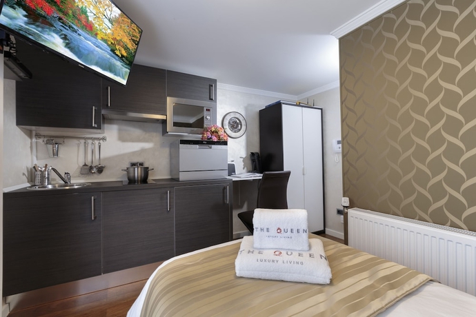 Imagen de la habitación del Hotel The Queen Luxury Apartments Villa Vinicia. Foto 13