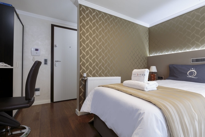 Imagen de la habitación del Hotel The Queen Luxury Apartments Villa Vinicia. Foto 15