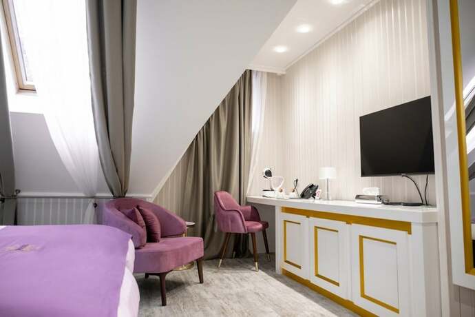 Imagen de la habitación del Hotel The Queen Palace. Foto 11