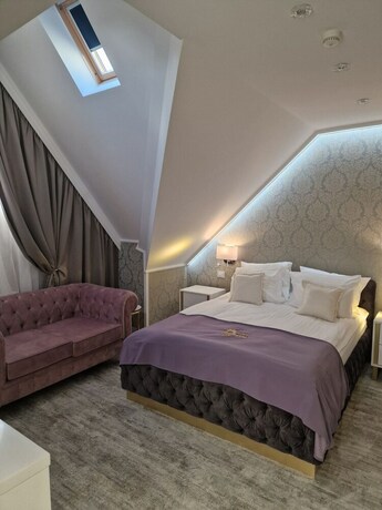 Imagen de la habitación del Hotel The Queen Palace. Foto 14