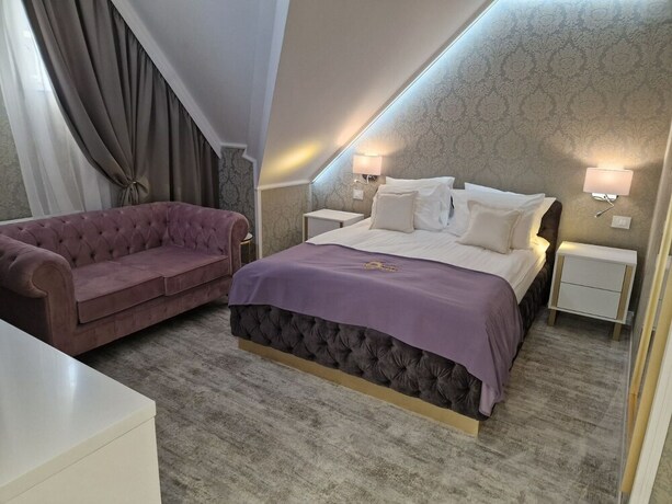 Imagen de la habitación del Hotel The Queen Palace. Foto 15