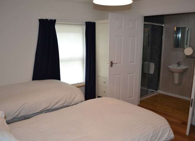 Imagen de la habitación del Hotel The Queens Head. Foto 18