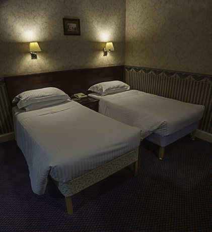 Imagen de la habitación del Hotel The Queen's Hotel. Foto 11