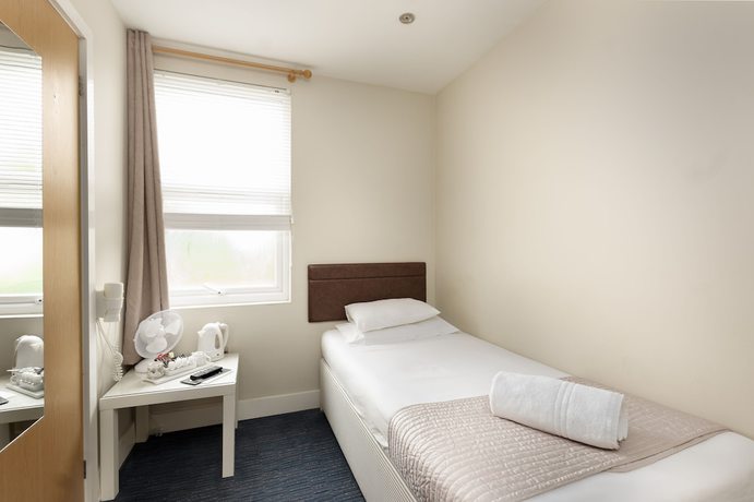 Imagen de la habitación del Hotel The R Inn. Foto 6