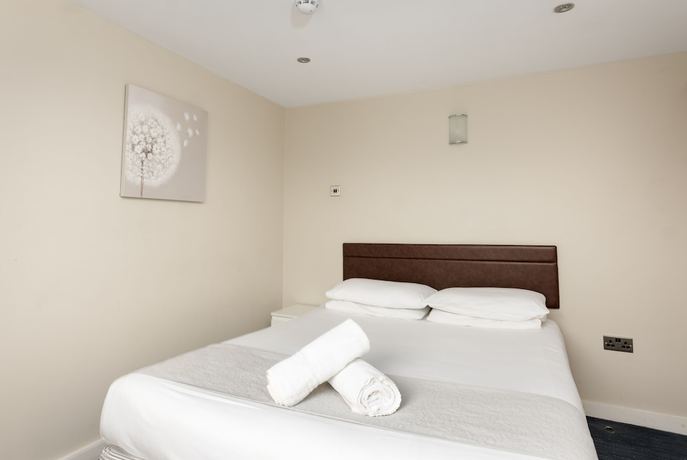 Imagen de la habitación del Hotel The R Inn. Foto 18