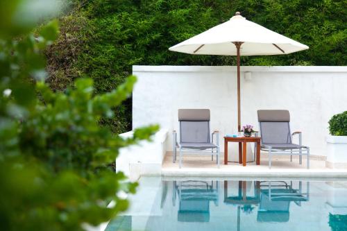 Imagen de la habitación del Hotel The Racha. Foto 11