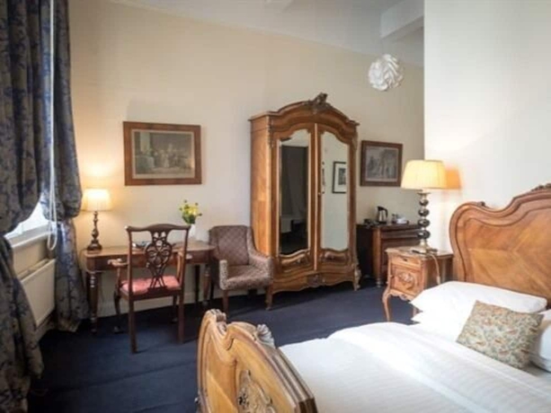 Imagen de la habitación del Hotel The Racquet Club. Foto 12