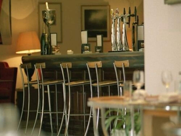 Imagen del bar/restaurante del Hotel The Racquet Club. Foto 5