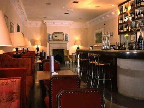 Imagen del bar/restaurante del Hotel The Racquet Club. Foto 6