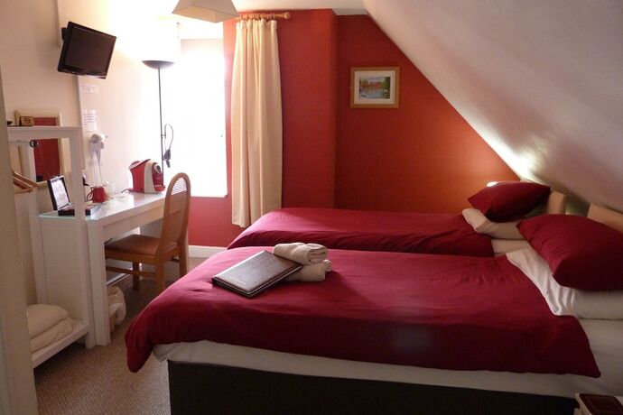 Imagen de la habitación del Hotel The Railway Inn. Foto 16