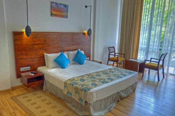 Imagen de la habitación del Hotel The Rain Tree. Foto 2