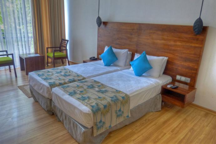 Imagen de la habitación del Hotel The Rain Tree. Foto 4