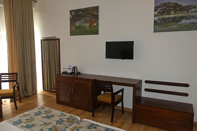 Imagen de la habitación del Hotel The Rain Tree. Foto 6