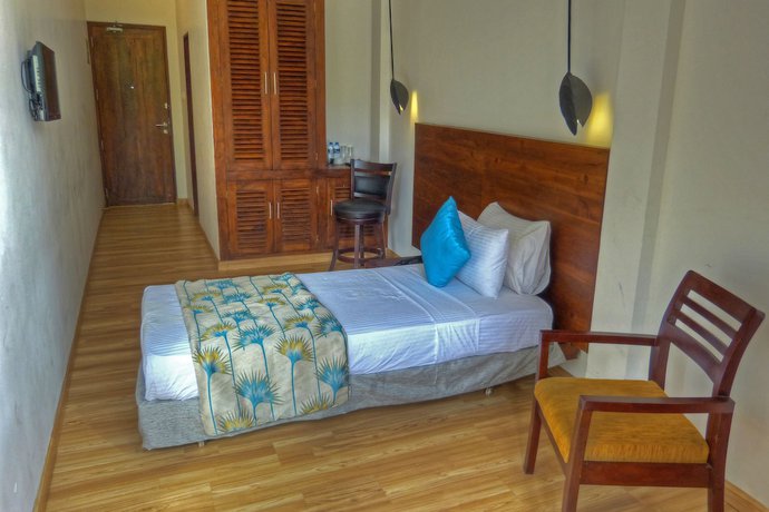 Imagen de la habitación del Hotel The Rain Tree. Foto 7