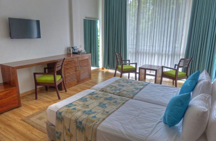 Imagen de la habitación del Hotel The Rain Tree. Foto 8