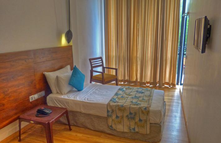 Imagen de la habitación del Hotel The Rain Tree. Foto 12