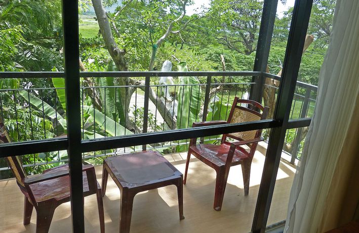 Imagen de la habitación del Hotel The Rain Tree. Foto 15