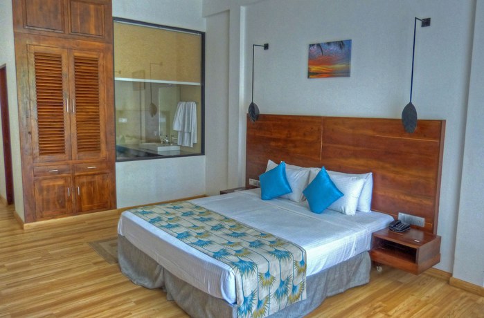 Imagen de la habitación del Hotel The Rain Tree. Foto 16