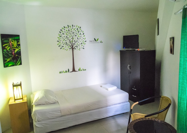 Imagen de la habitación del Hotel The Rainforest Guesthouse and Cafe. Foto 8