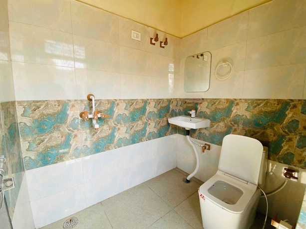 Imagen de la habitación del Hotel The Raman Palace - A Budget. Foto 5