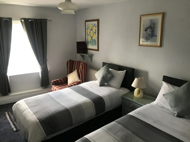 Imagen de la habitación del Hotel The Red House Guest House. Foto 16