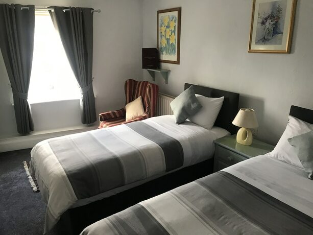 Imagen de la habitación del Hotel The Red House Guest House. Foto 17