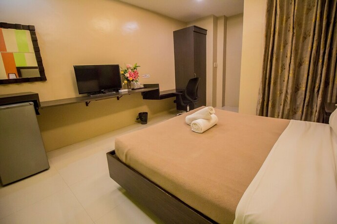 Imagen de la habitación del Hotel The Red Palm Suites And Restaurant. Foto 14